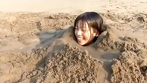 Girl Buried In Beach